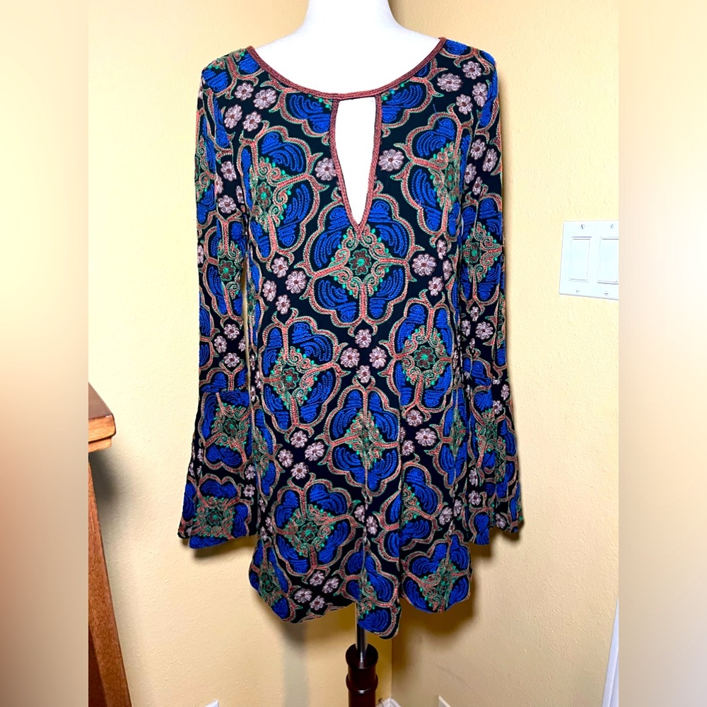 Free People embroidered mini dress with flared sleeves. Medium